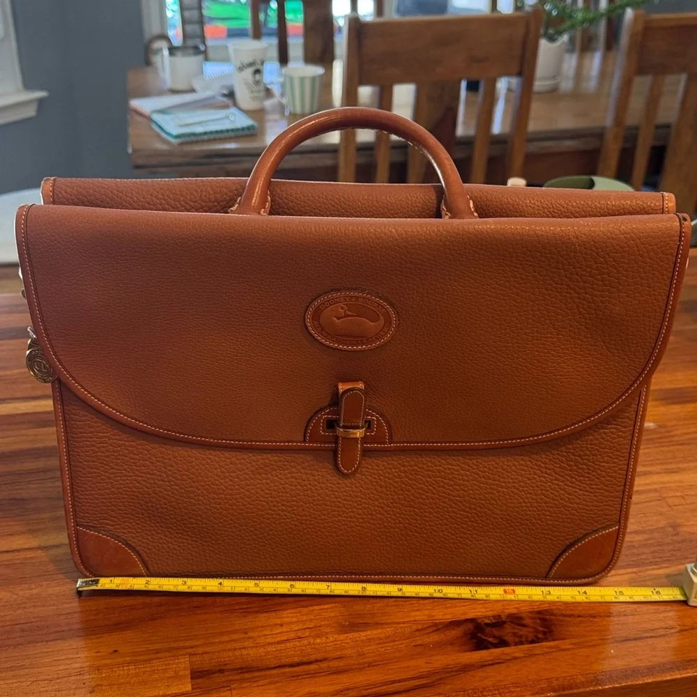 Vintage camel colored Dooney and Bourke all weather leather briefcase/laptop bag